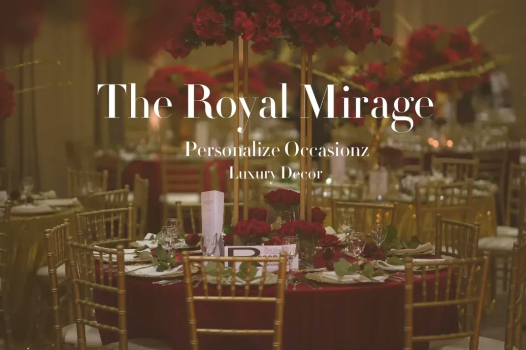 Round tables with deep red roses, gold chairs and candlelight in The Royal Mirage collection.
