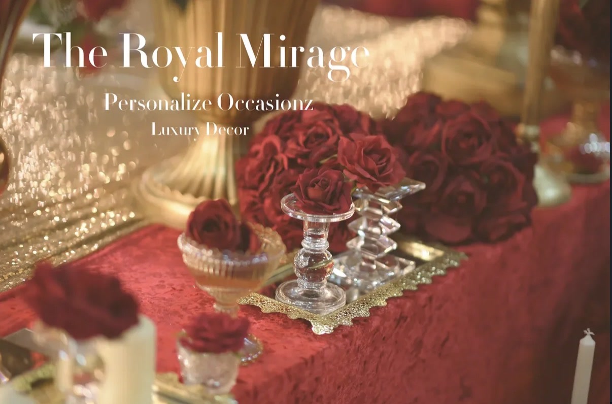 A walima table set with deep red roses and crystal.
